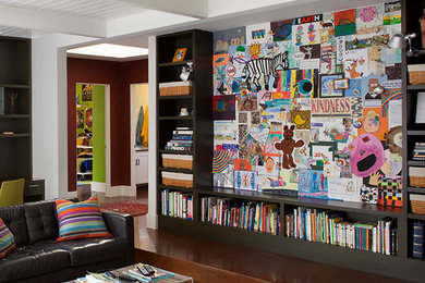 Example of a mid-sized country open concept concrete floor family room design in San Francisco with multicolored walls, no fireplace and a wall-mounted tv