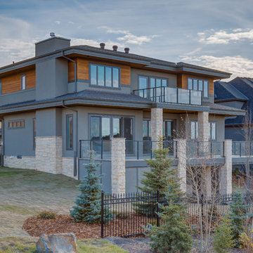Custom 2 Storey Backing on to cascading ponds