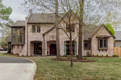 Example of a french country exterior home design in Houston