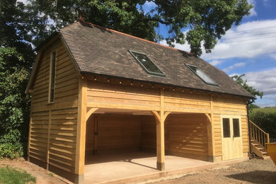 Photo of a large rustic detached double carport in Gloucestershire.