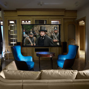 Photo of an eclectic home cinema in Moscow with grey walls, a projector screen and painted wood flooring.