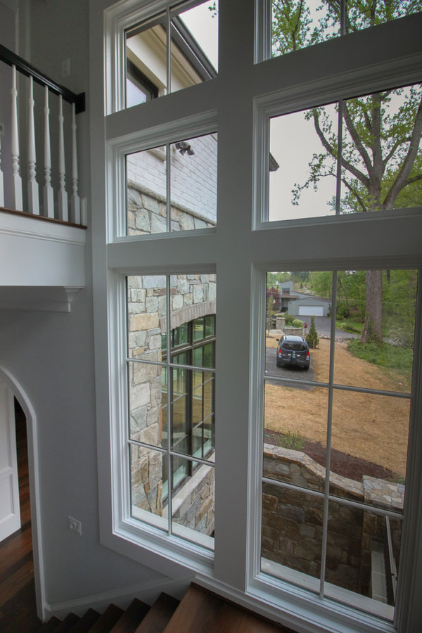 Powerful Impression by Floating Staircase in Suburban Foyer