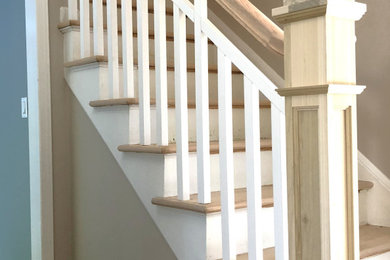 Staircase - small wooden straight wood railing staircase idea in Orlando with wooden risers