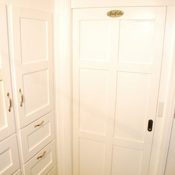 Entry door in the closed position. Styled to match surrounding cabinets.