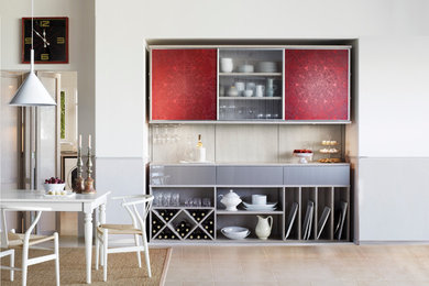 Inspiration for a small contemporary single-wall home bar in Hawaii with open cabinets, grey cabinets, beige splashback, ceramic splashback, ceramic floors and beige floor.