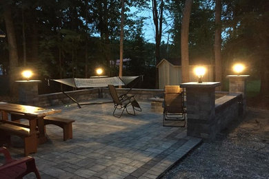Backyard Walled Patio with Firepit & Lamp Posts