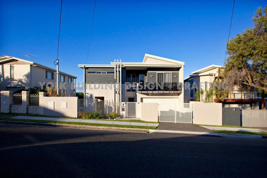 Modern two-storey grey exterior in Brisbane with mixed siding.