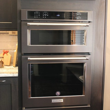 DuraSupreme Peppercorn Kitchen With Cambria Tops and Black Stainless Appliances
