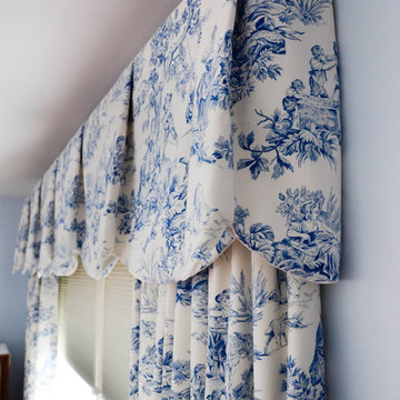 Blue and white toile Sheffield valances and draperies in a master bedroom
