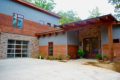 Large contemporary blue two-story metal exterior home idea in Little Rock