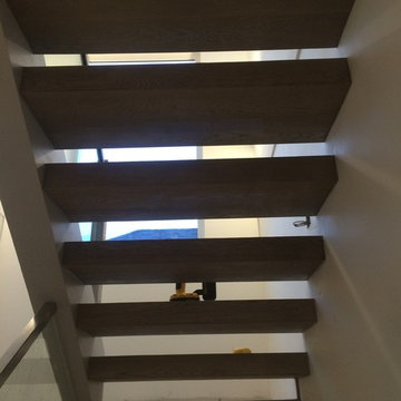 Custom Home. Stairs wrapped with Hardwood