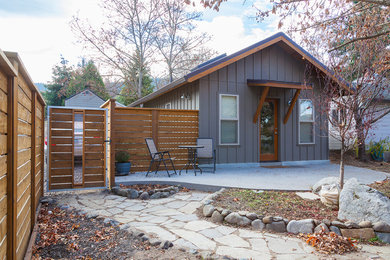 Transitional gable roof photo in Other with a metal roof
