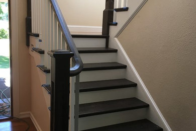 Inspiration for a large arts and crafts wood u-shaped staircase in Seattle with wood railing.