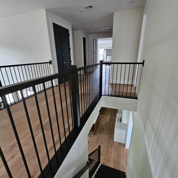 Project #130 | Curved Staircase with Wraparound Balcony