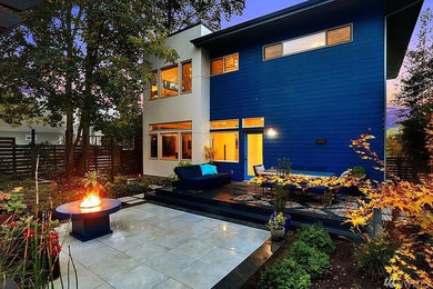 This is an example of a medium sized modern back garden in Seattle.