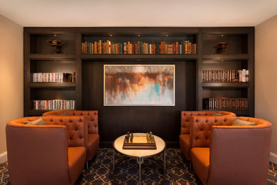 Example of a mid-sized transitional enclosed carpeted and multicolored floor family room library design in Los Angeles with beige walls, no fireplace and no tv