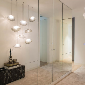 Entry Hall with Mirrored Wall and Marble Bench