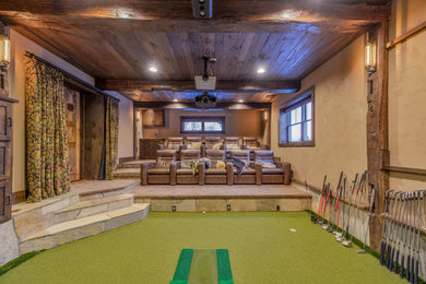 Large mountain style look-out green floor and shiplap ceiling basement photo in Minneapolis with a home theater, beige walls and no fireplace