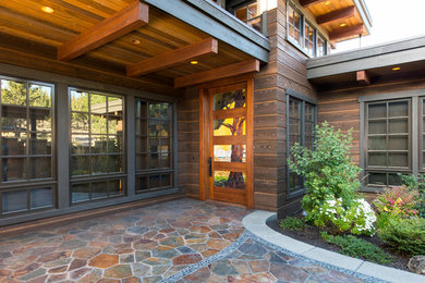 Example of an arts and crafts entryway design in Other