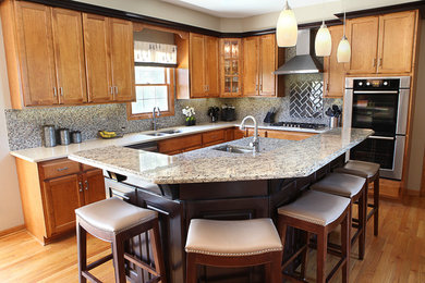 Custom island with new countertop; perimeter cabinetry was existing but new quar