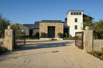 Example of a huge cottage entryway design in San Francisco with a glass front door