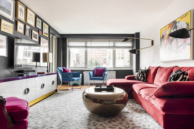 Example of a mid-sized eclectic enclosed living room design in New York with black walls and a wall-mounted tv