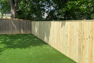 This is an example of a large modern backyard wood fence landscaping in DC Metro.