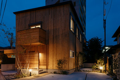 This is an example of a brown exterior in Other with wood siding.