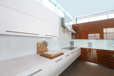 Inspiration for a large modern l-shaped medium tone wood floor and brown floor eat-in kitchen remodel in Edmonton with medium tone wood cabinets, granite countertops, white backsplash, glass sheet backsplash, an island and stainless steel appliances