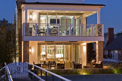 Inspiration for a large coastal white two-story exterior home remodel in Orange County