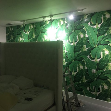 vintage wall-covering installation and flamingo wallpaper