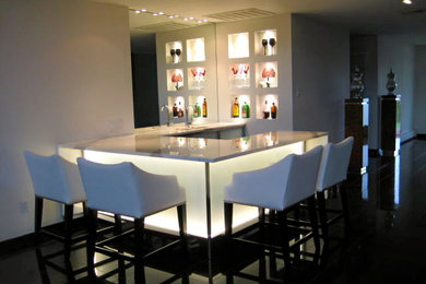 Design ideas for a contemporary home bar in New York.