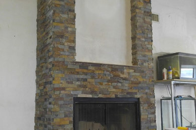 Stacked stone on fireplace & hardwood install