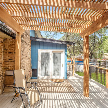 Composite deck, cedar pergola, metal railing with cedar posts