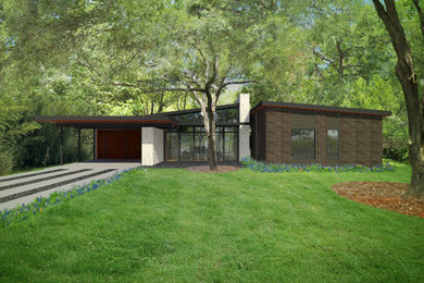 Inspiration for a mid-sized mid-century modern black one-story brick house exterior remodel in Austin with a shed roof