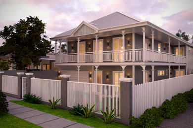 Inspiration for a traditional two-storey grey exterior in Sydney with wood siding and a hip roof.