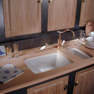 Mid-sized traditional kitchen pantry ideas - Inspiration for a mid-sized timeless single-wall kitchen pantry remodel in Paris with an undermount sink, brown backsplash, recessed-panel cabinets, medium tone wood cabinets and wood countertops