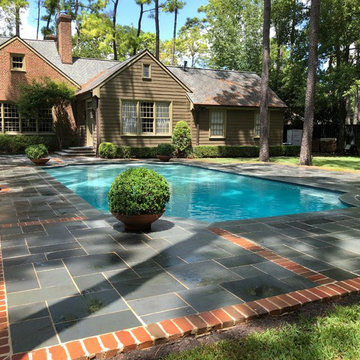 Flagstone with brick border pool deck