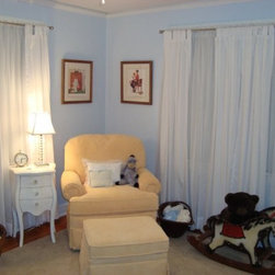 Cozy nursery corner with glider, antique style stand, vintage prints - Kids Decor