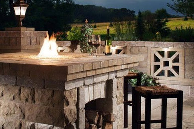 Inspiration for a mid-sized traditional backyard patio in Other with a fire feature and no cover.