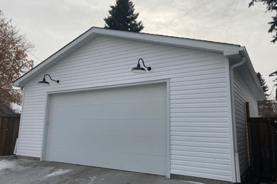 Mid-sized detached two-car garage photo in Edmonton