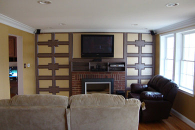 Mid-sized transitional light wood floor and brown floor living room photo in Baltimore with beige walls, a standard fireplace, a brick fireplace and a wall-mounted tv