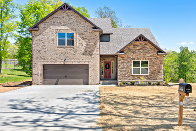 Example of a farmhouse exterior home design in Nashville