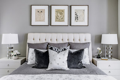 Inspiration for a mid-sized transitional master bedroom in Austin with grey walls and carpet.