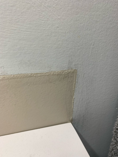How to remove caulking from walls