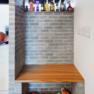Inspiration for a mid-sized industrial mudroom in Seattle with white walls.
