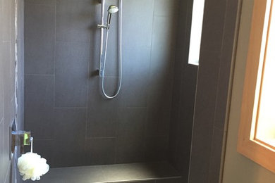 Transitional master slate tile walk-in shower photo in Portland with beige walls