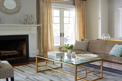 Example of a large classic formal and open concept carpeted living room design in New York with gray walls, a standard fireplace and no tv