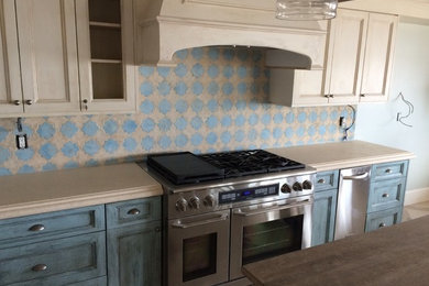 Inspiration for a large country u-shaped porcelain tile open concept kitchen remodel in San Diego with a farmhouse sink, recessed-panel cabinets, gray cabinets, marble countertops, multicolored backsplash, mosaic tile backsplash, stainless steel appliances and an island