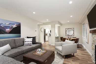 Small transitional open concept vinyl floor and brown floor living room photo in Other with beige walls